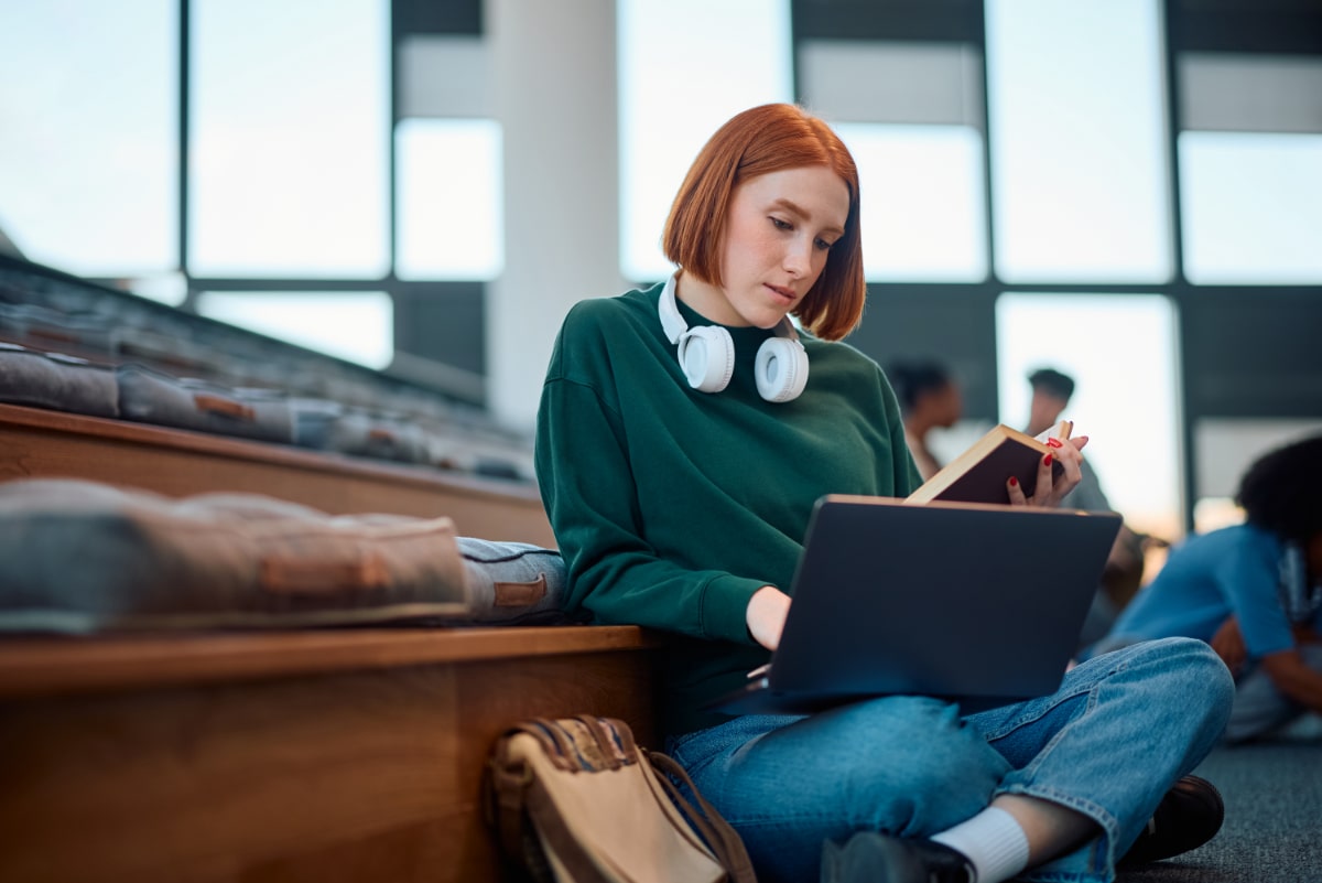 Girl in common room using laptop