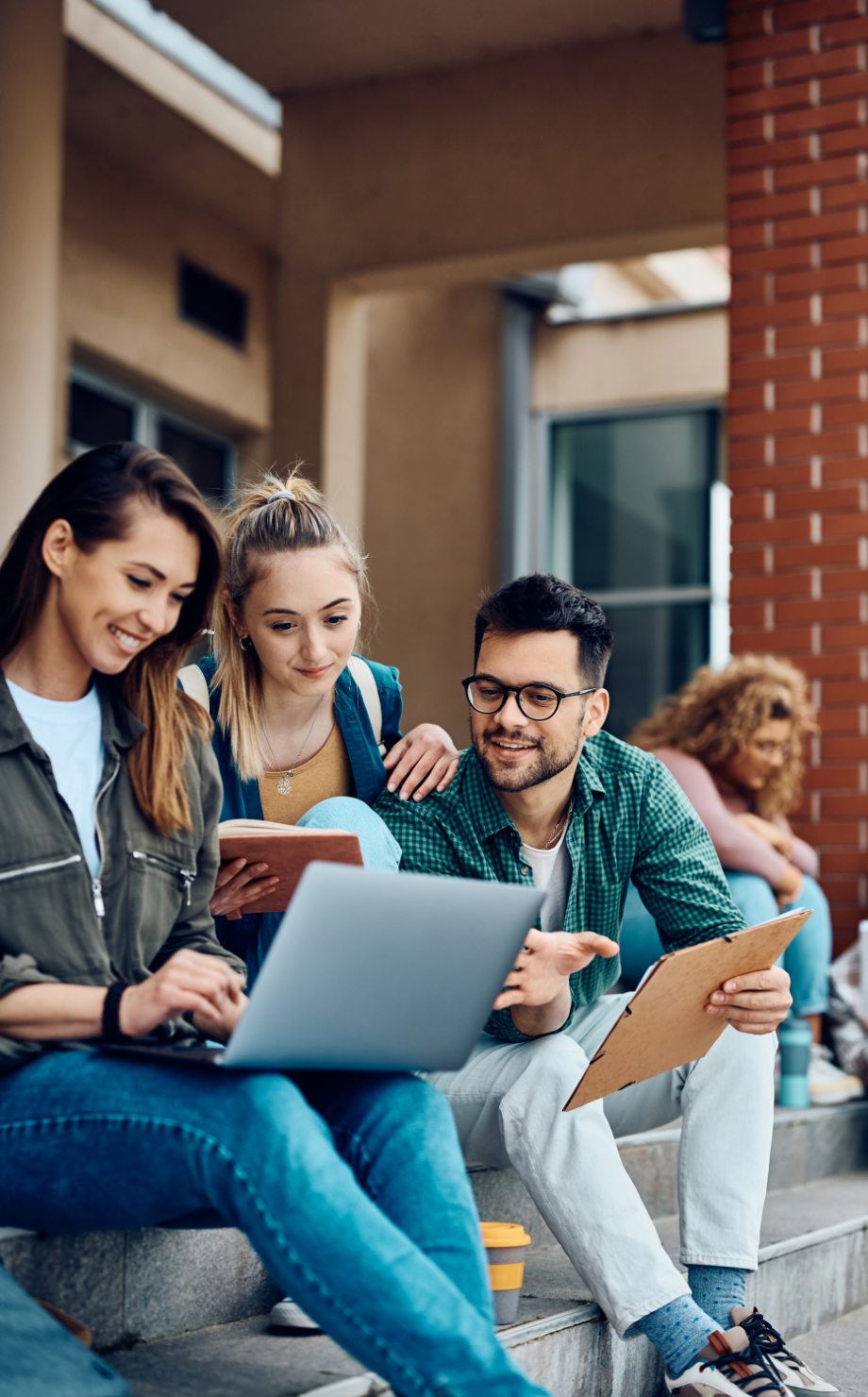 Group of students checking something on a laptop